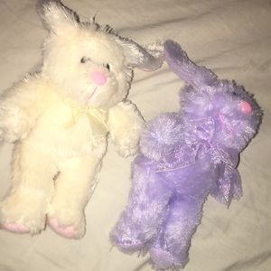 two teddy bears (one purple one white)
